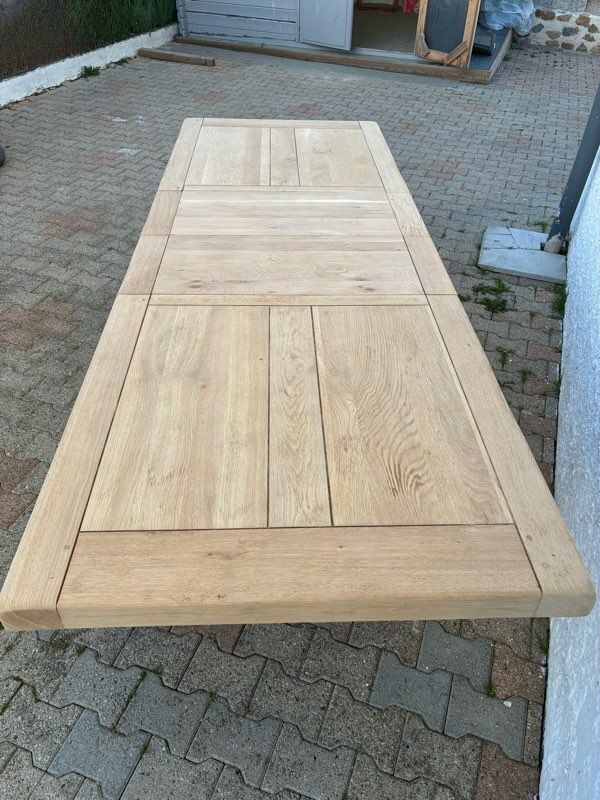 Solid oak farmhouse table with extensions.