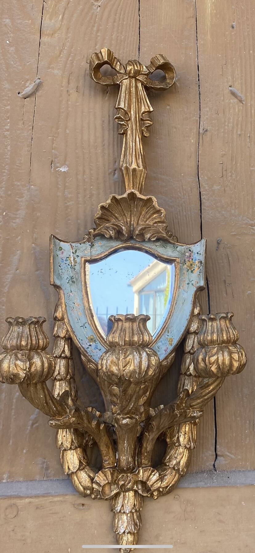 Pair of carved wood sconces