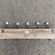 Wall-mounted coat rack with 5 hooks, solid wood, Maisons du Monde.