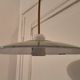 Old suspension in green enamelled sheet metal and porcelain socket to hang