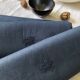 Lot four damasked and monogrammed towels linen and night blue silk