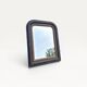 Antique mirror in Napoléon III style, blackened with beaded frieze, 42x55cm.