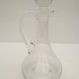 small glass decanter with its handle and spout