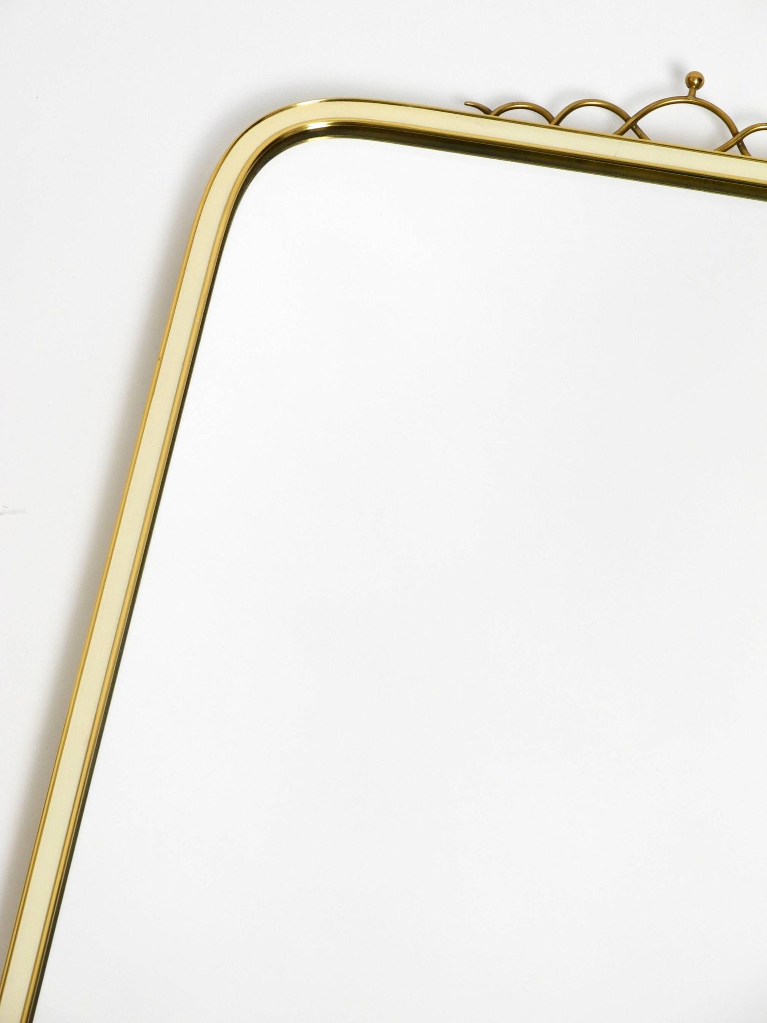 Large heavy long Mid Century brass wall mirror by Münchner Zierspiegel