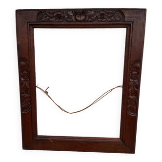 Wooden frame with carved decor
