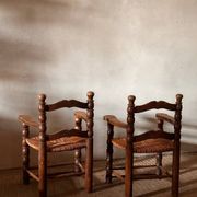 Pair of French spindle chairs in the style of Charles Dudouyt.