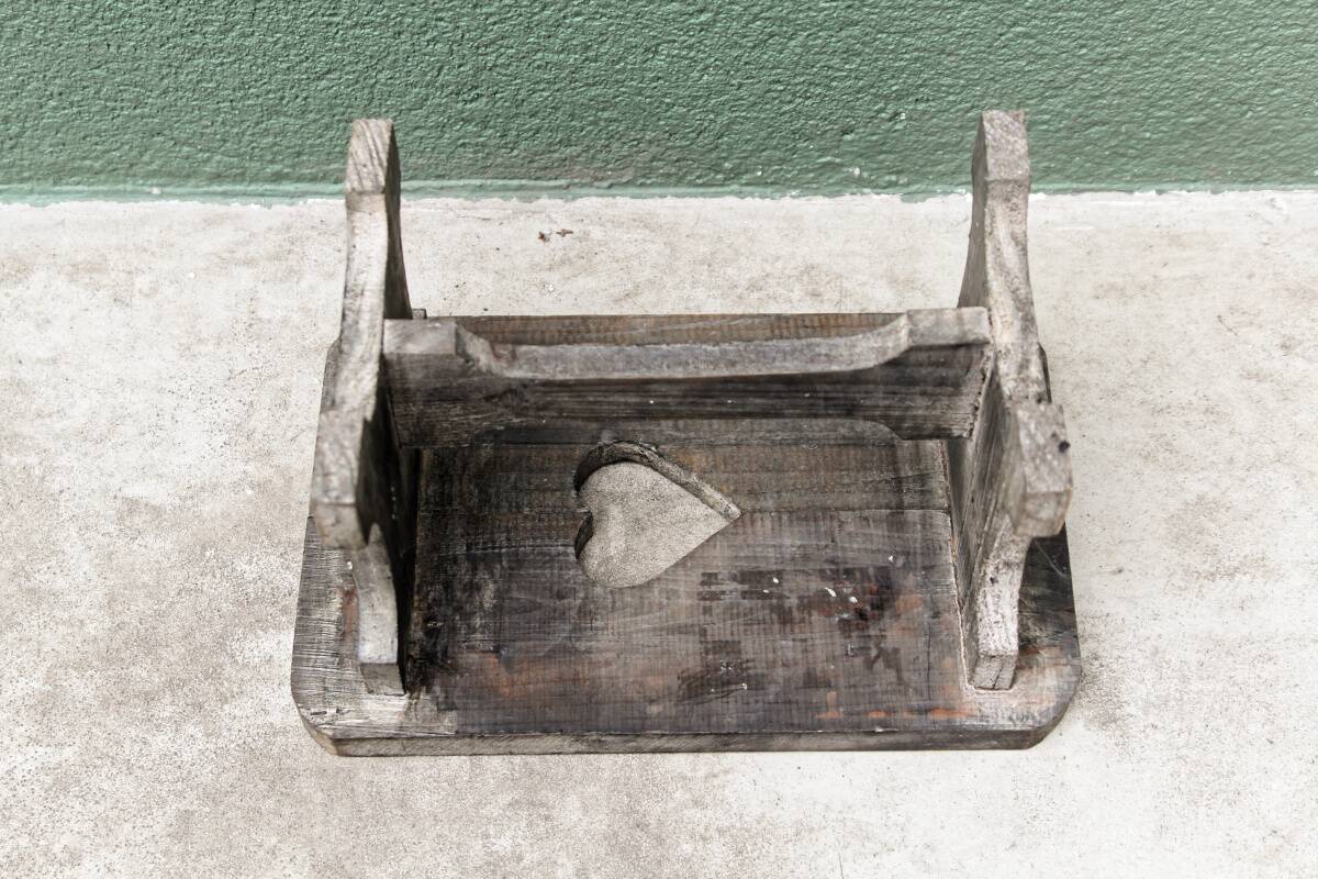 Wooden footrest, heart cutout