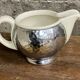 Ceramic/tinned milk jug.