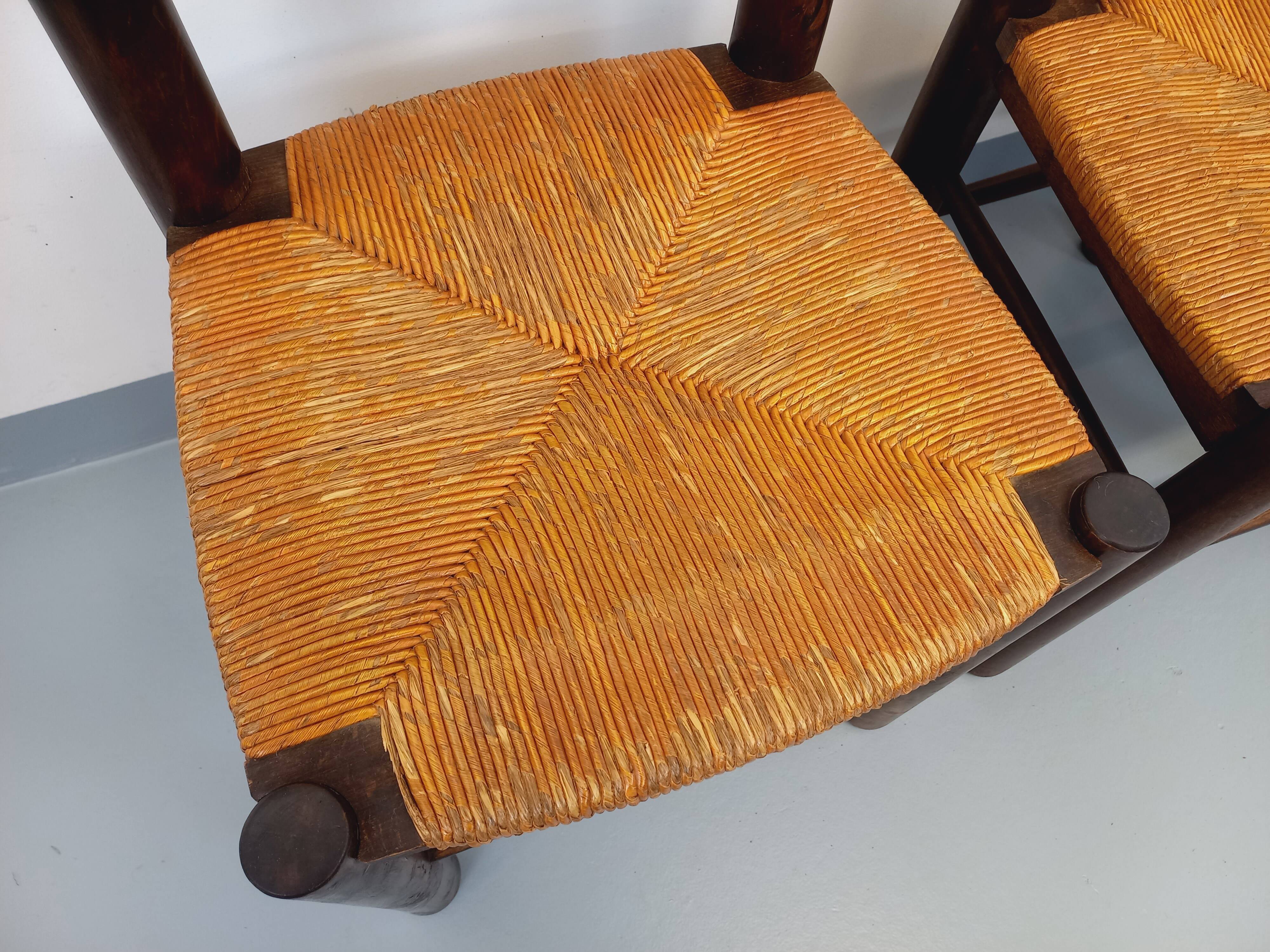 Set of 4 vintage brutalist chairs by Georges Robert in wood and straw.