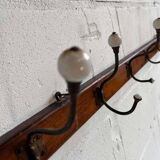 Vintage industrial wooden coat rack with porcelain hooks