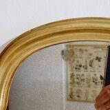 Free form mirror in golden wood