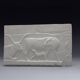 Plaster depicting two cows and a calf, based on an Egyptian fresco.