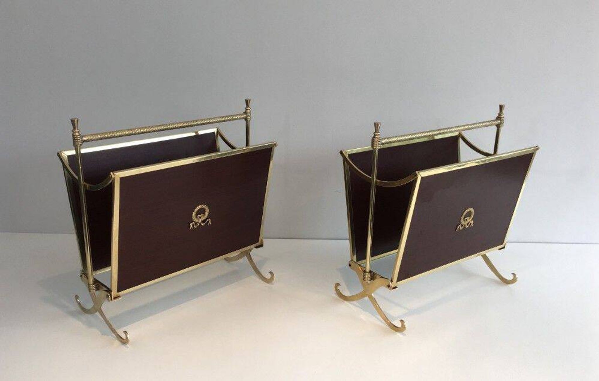 Pair of mahogany and brass magazine racks. Maison Jansen