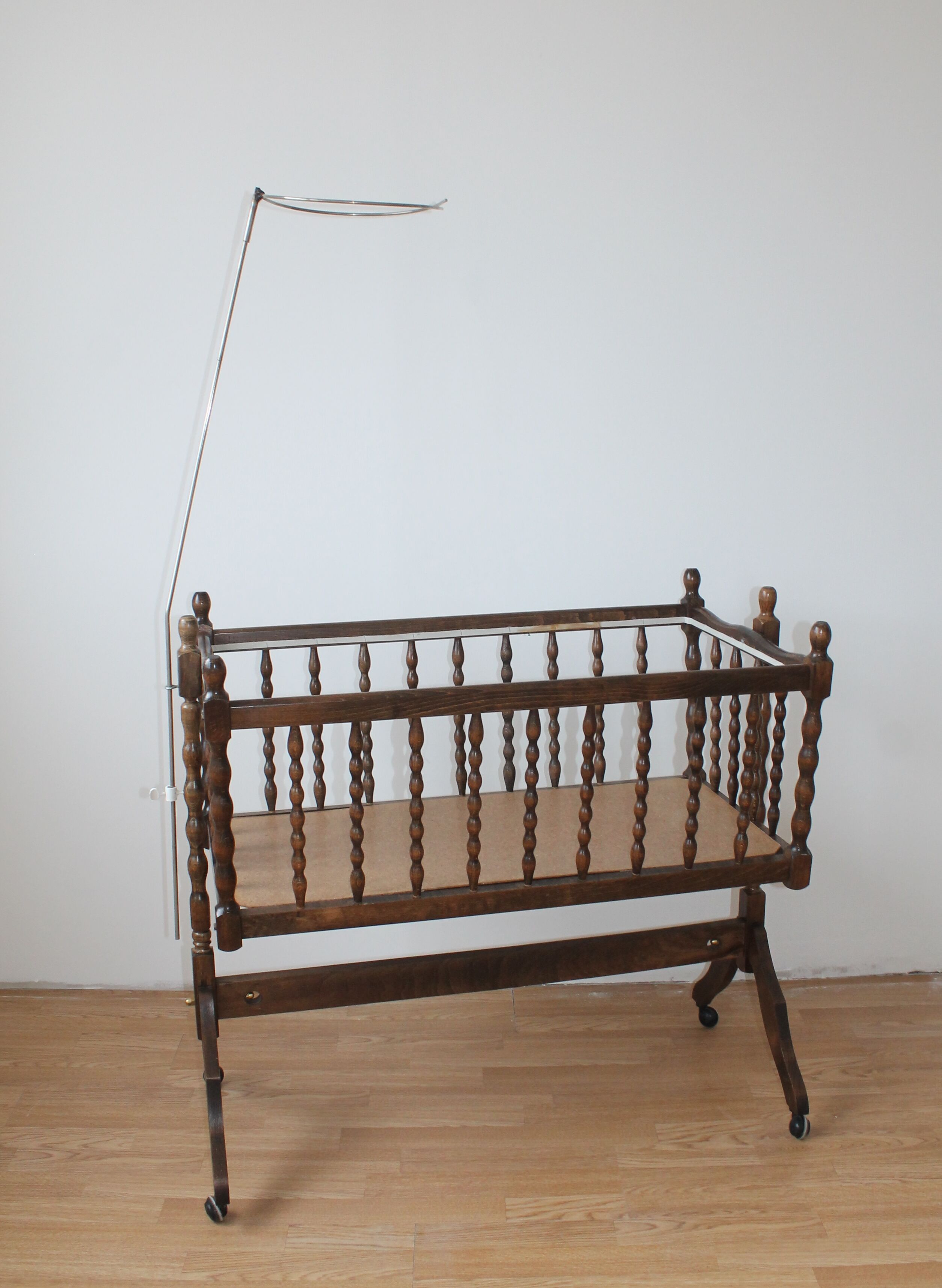 Old Vintage cradle with balance on wheels