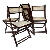 Set de quatre chaises pliantes en bois et cannage
