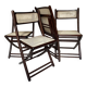 Set de quatre chaises pliantes en bois et cannage
