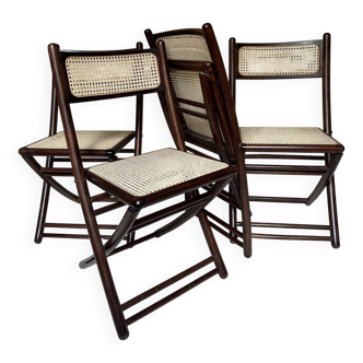 Set of four folding chairs in wood and cane.