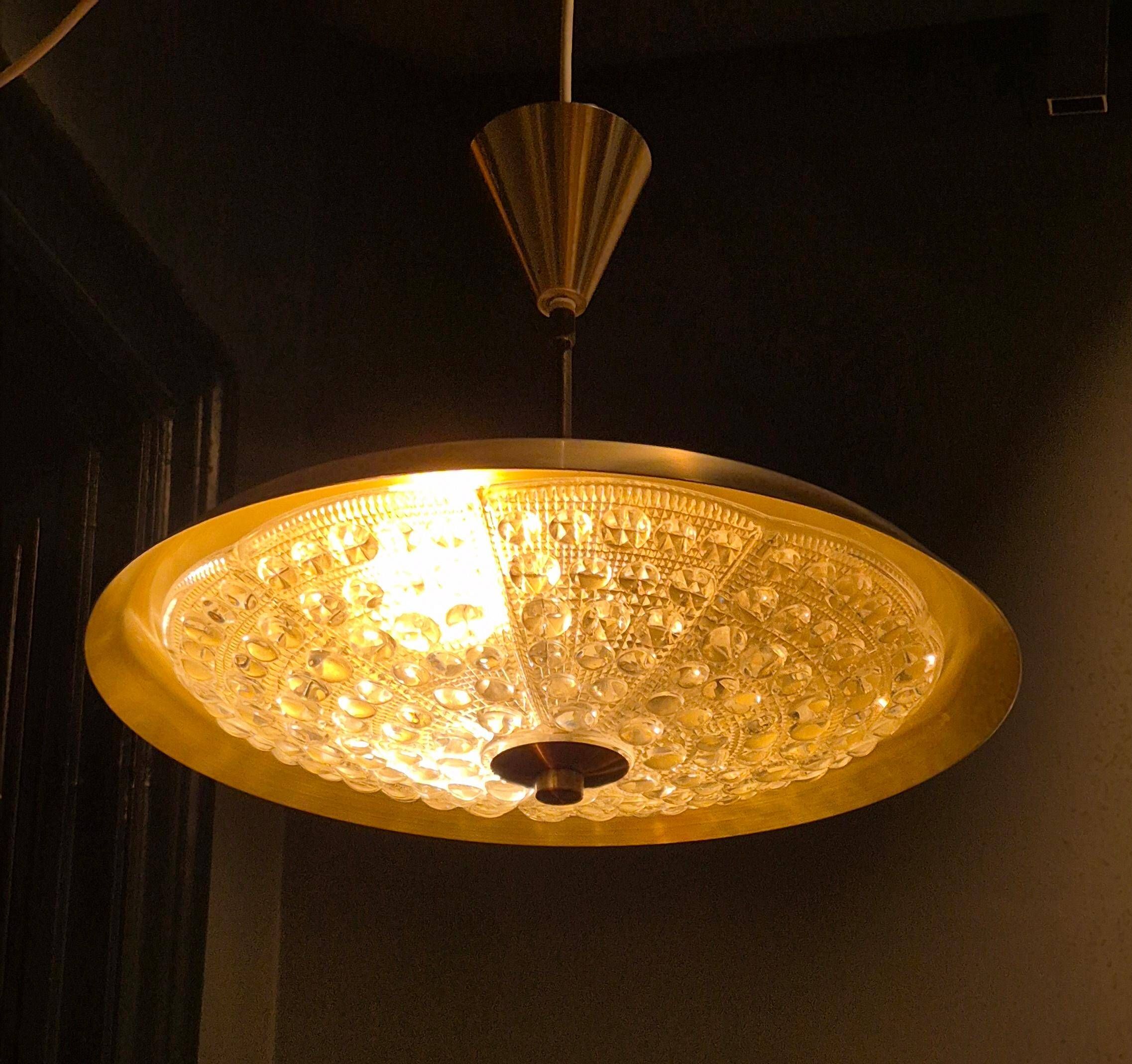 Carl Fagerlund, modern Swedish pendant in brass and beautiful Orrefors glass.