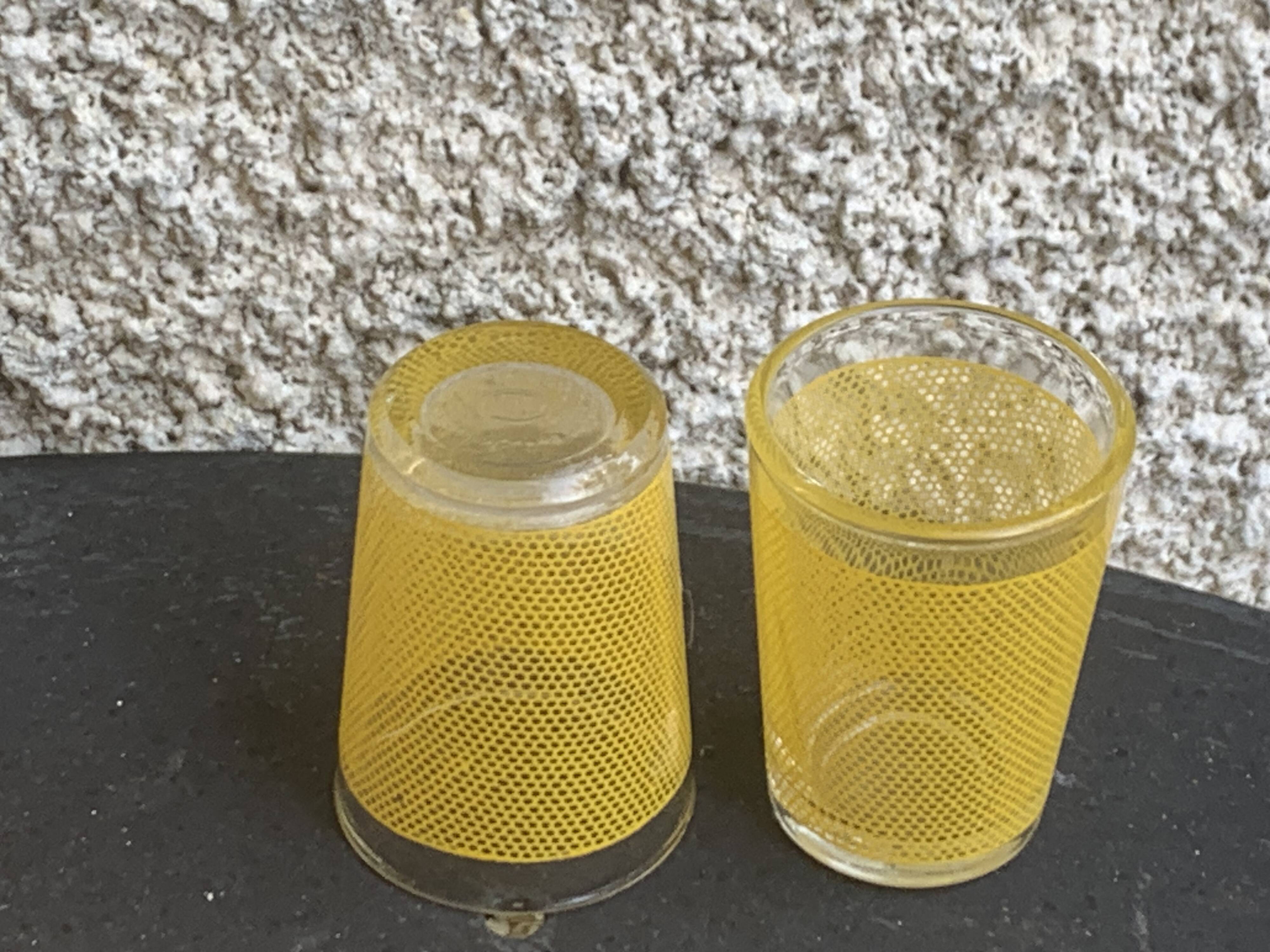 Liqueur set consisting of a glass carafe and 8 small yellow glasses