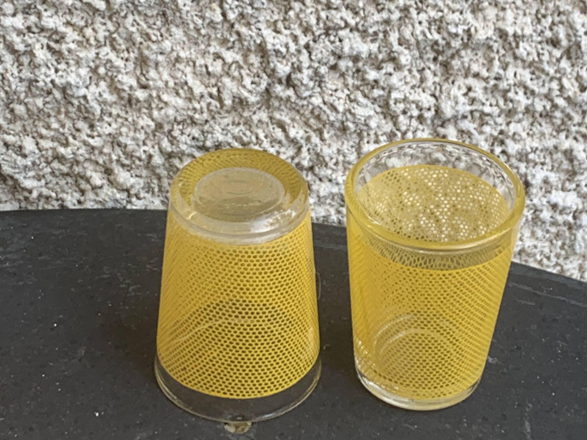 Liqueur set consisting of a glass carafe and 8 small yellow glasses