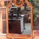 Miroir de style Louis XV en bois doré XXème