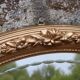 Miroir ovale vintage doré à décor floral et verre biseauté – 58 × 48 cm