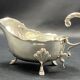 English George III style silver plated tripod sauce boat
