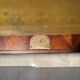 Antique mahogany secretary, upholstered flap and interior storage