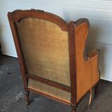 Large Louis XVI style bergère armchair in amber brown velvet