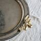 Vintage round silver metal serving tray with gold knot handles