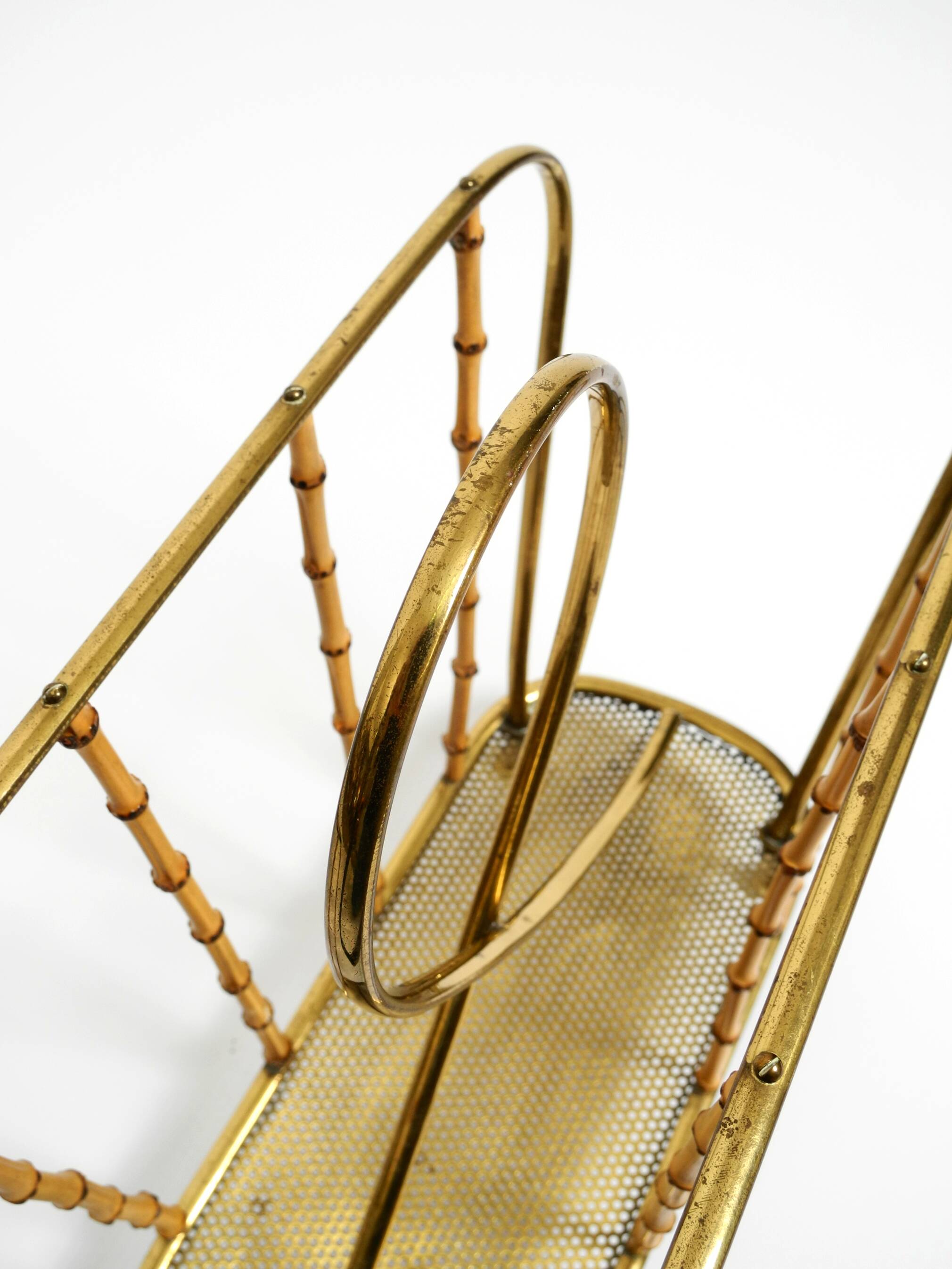 Rare Mid Century Modern magazine rack made of solid brass and genuine bambo