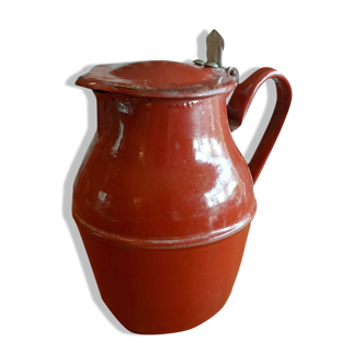 Old enamelled metal pitcher