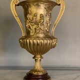 Golden bronze urn, base of red griotte marble.