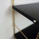 Vintage black and gold String design shelf. 60s