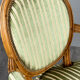 Pair of Louis XVI style armchairs in striped green fabric, 20th century.