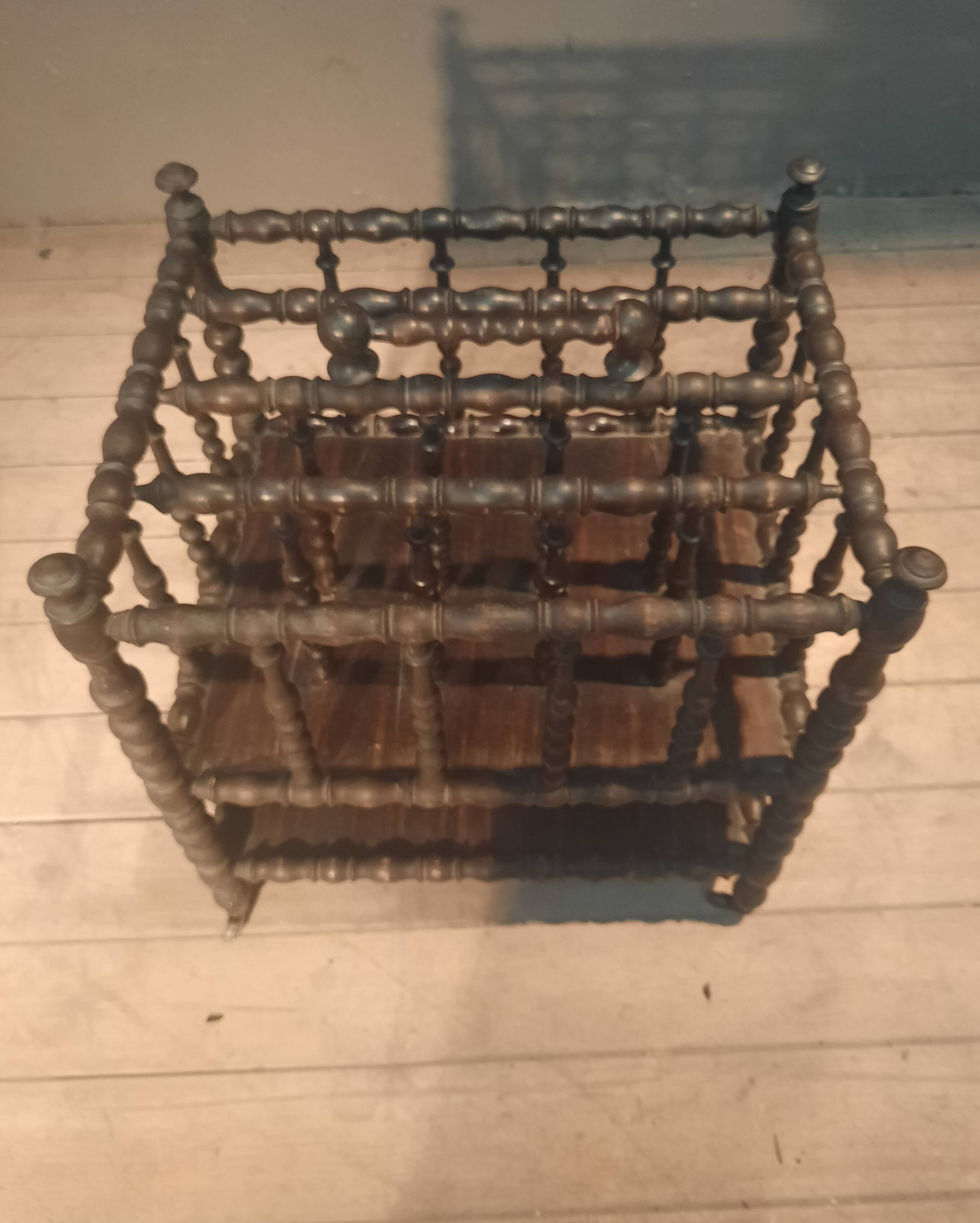 Rosewood magazine rack on casters