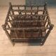 Rosewood magazine rack on casters