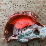 Empty pocket in glazed ceramic slip in the shape of vintage fish
