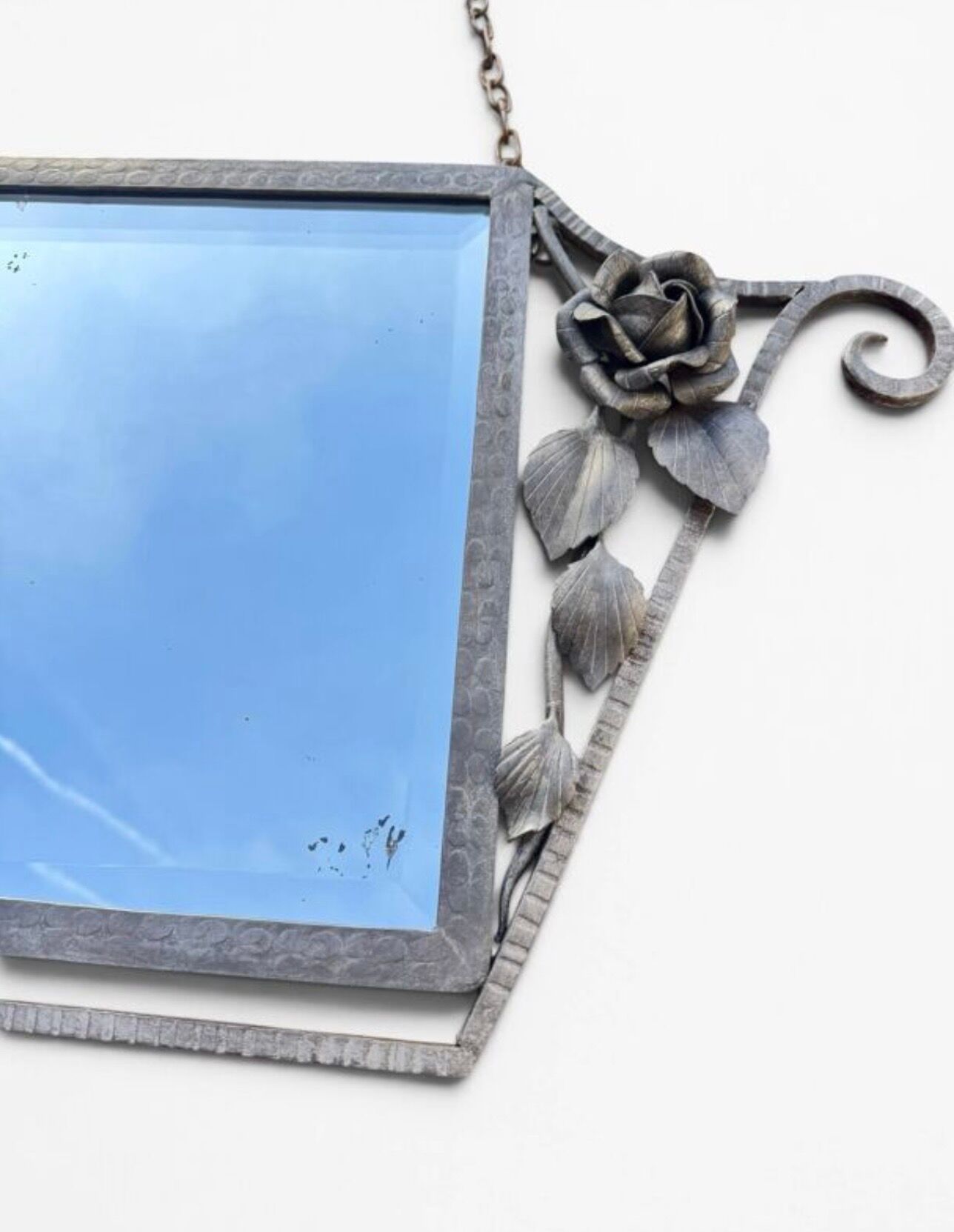 Art Deco mirror from the 1930s in silvered wrought iron, decorated with roses.
