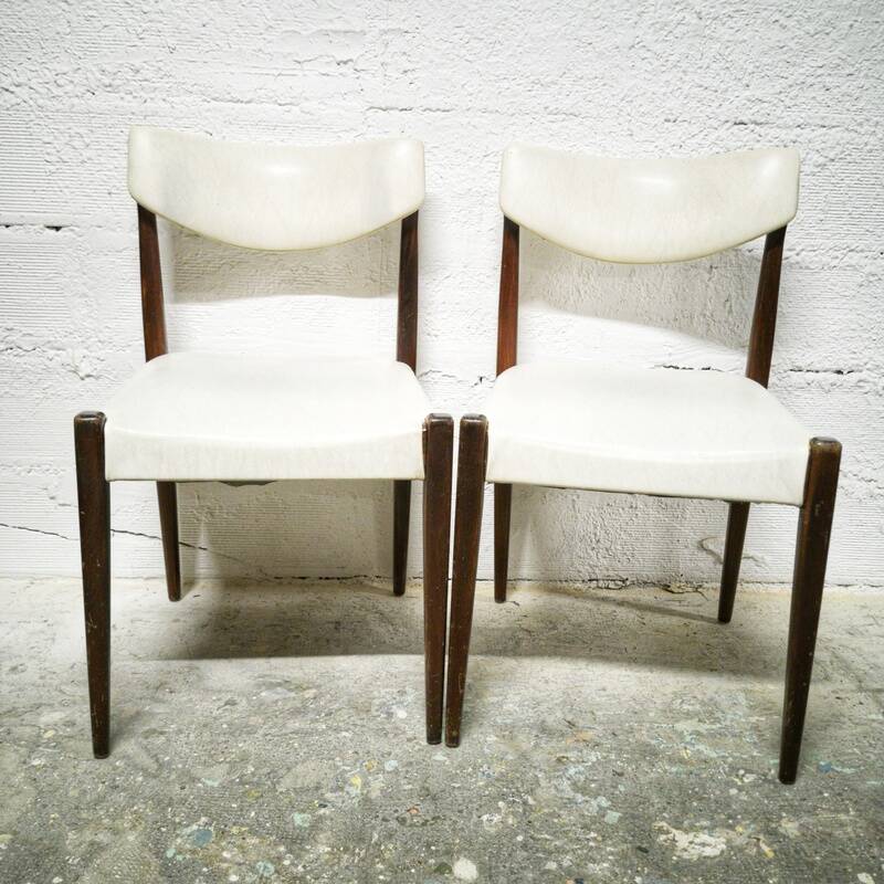 Pair of vintage teak and skai chairs