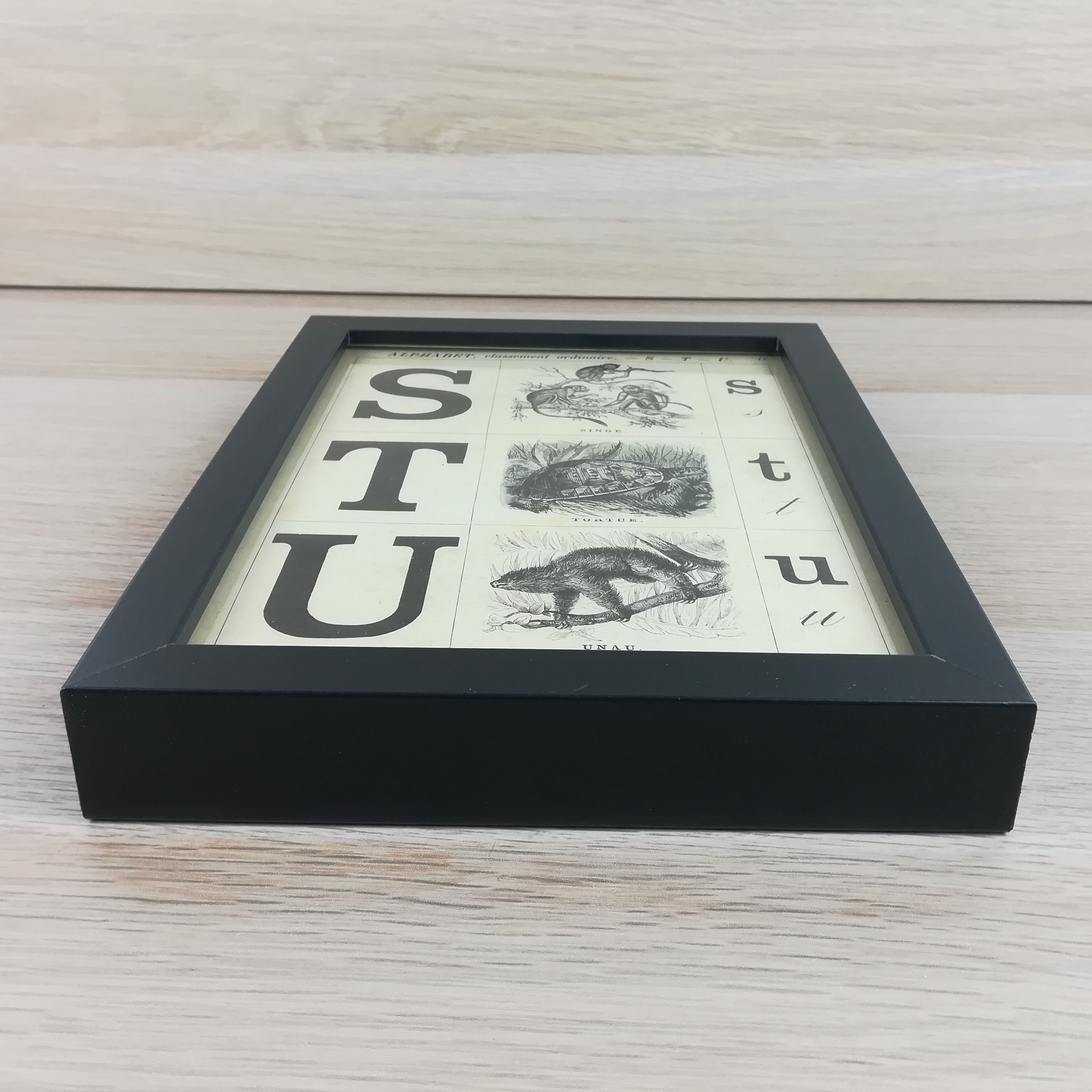 Framed s-t u alphabet board