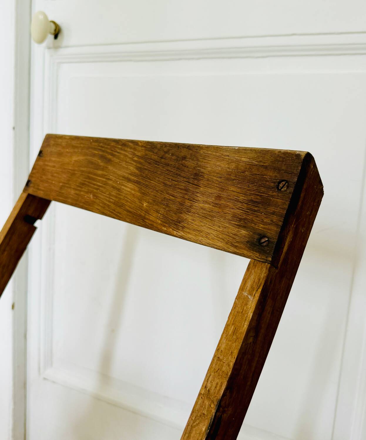 Two vintage wooden folding chairs, circa 1960