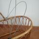 Rattan cradle with its support