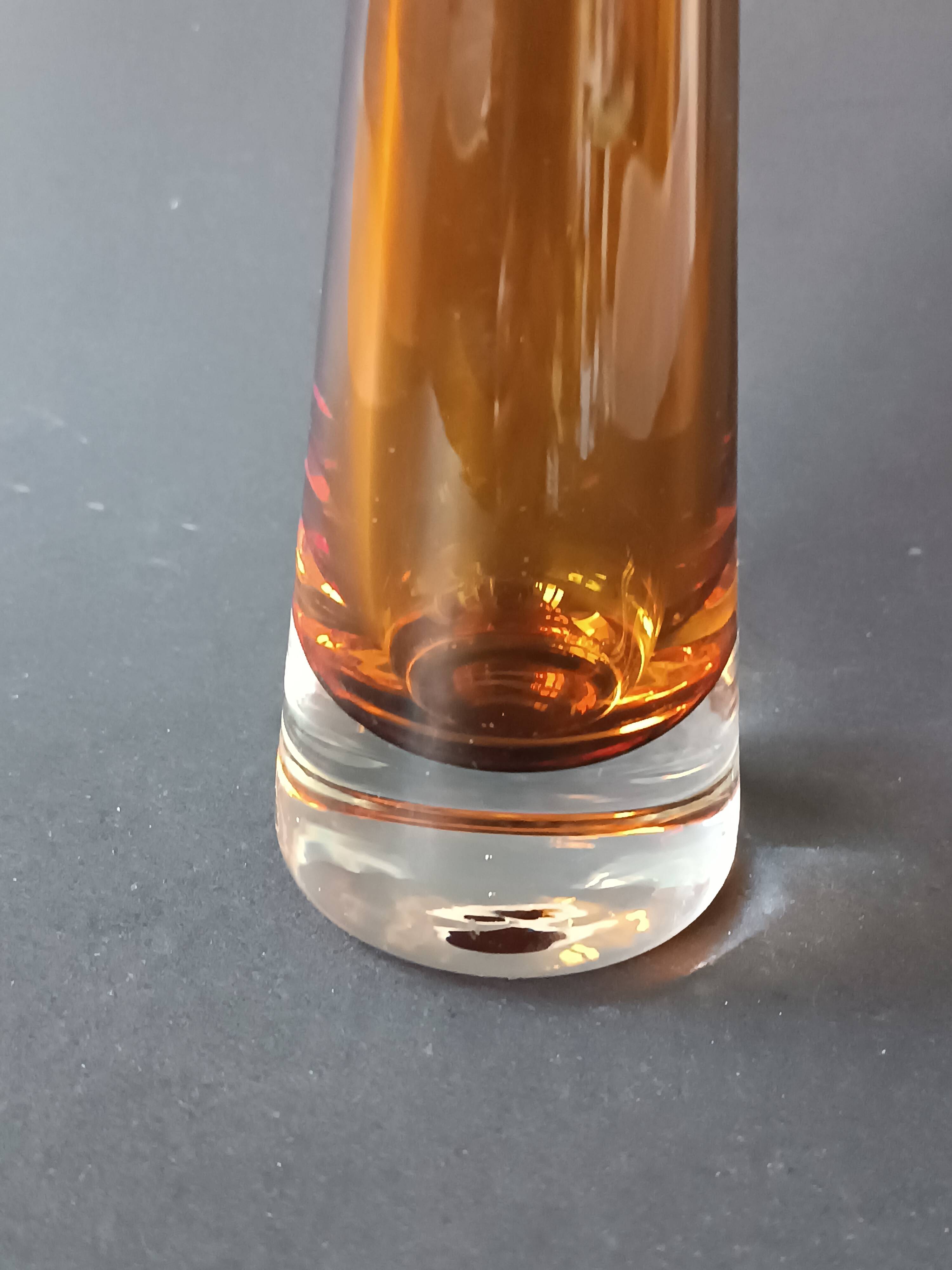 Two vintage Scandinavian double-layered amber blown glass candlesticks