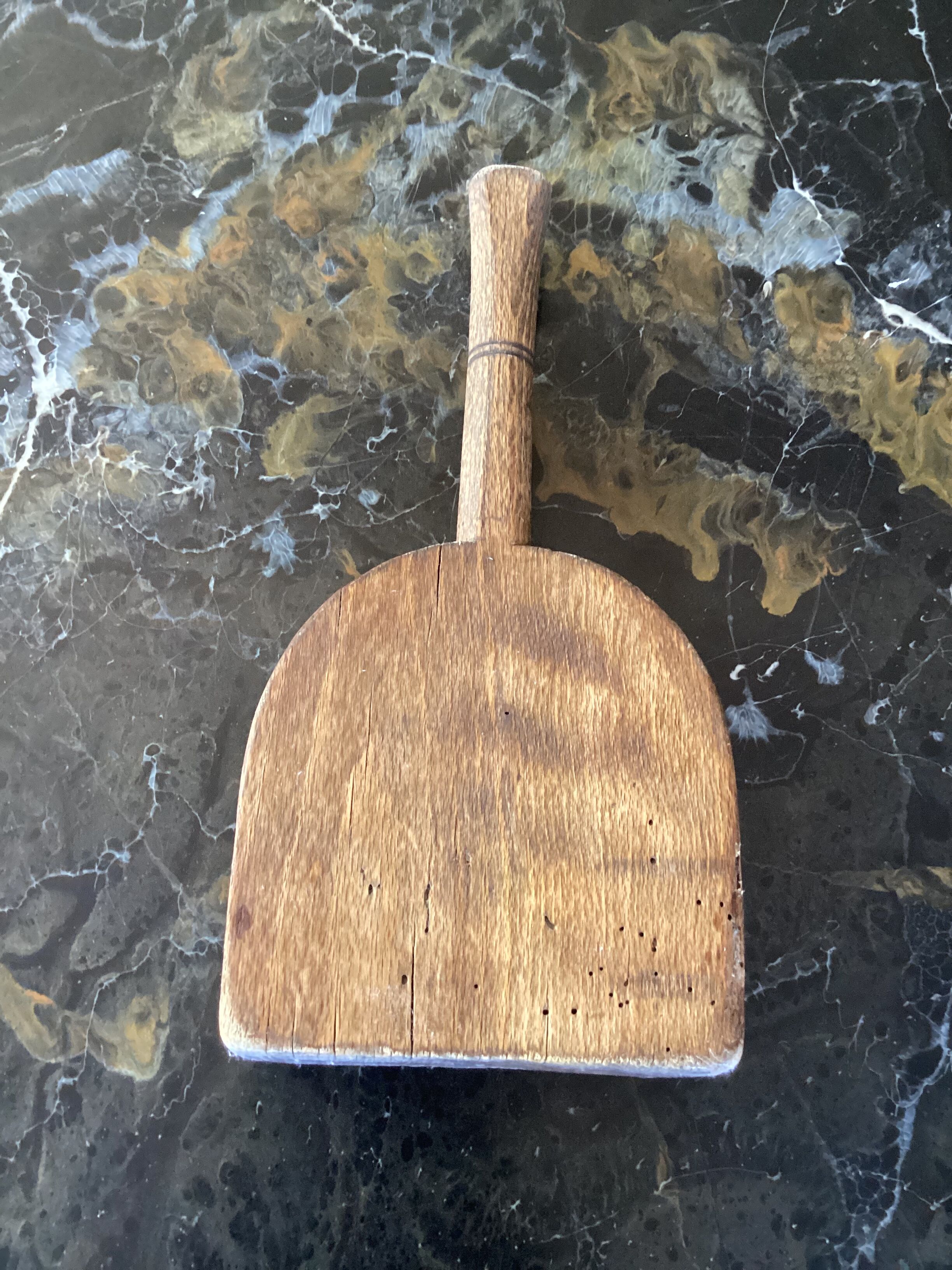 Old wooden clothes beater