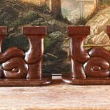 Pair of Art Deco carved wood candlesticks, signed Delaporte