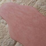 Organic shaped coffee table in pink teracotta tadelakt