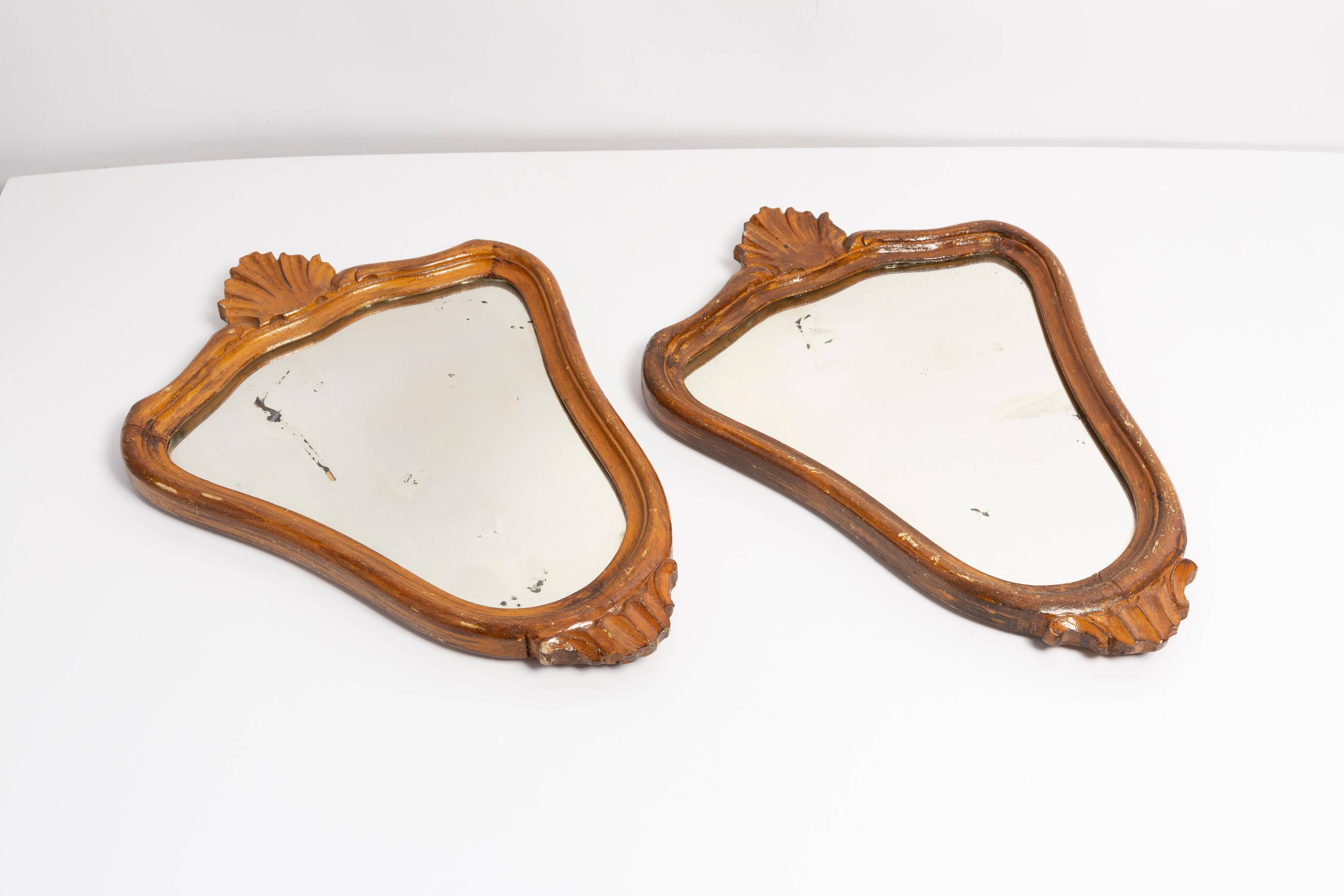 Pair of vintage Mid-Century decorative mirrors in a gold frame, Italy, 1960s.