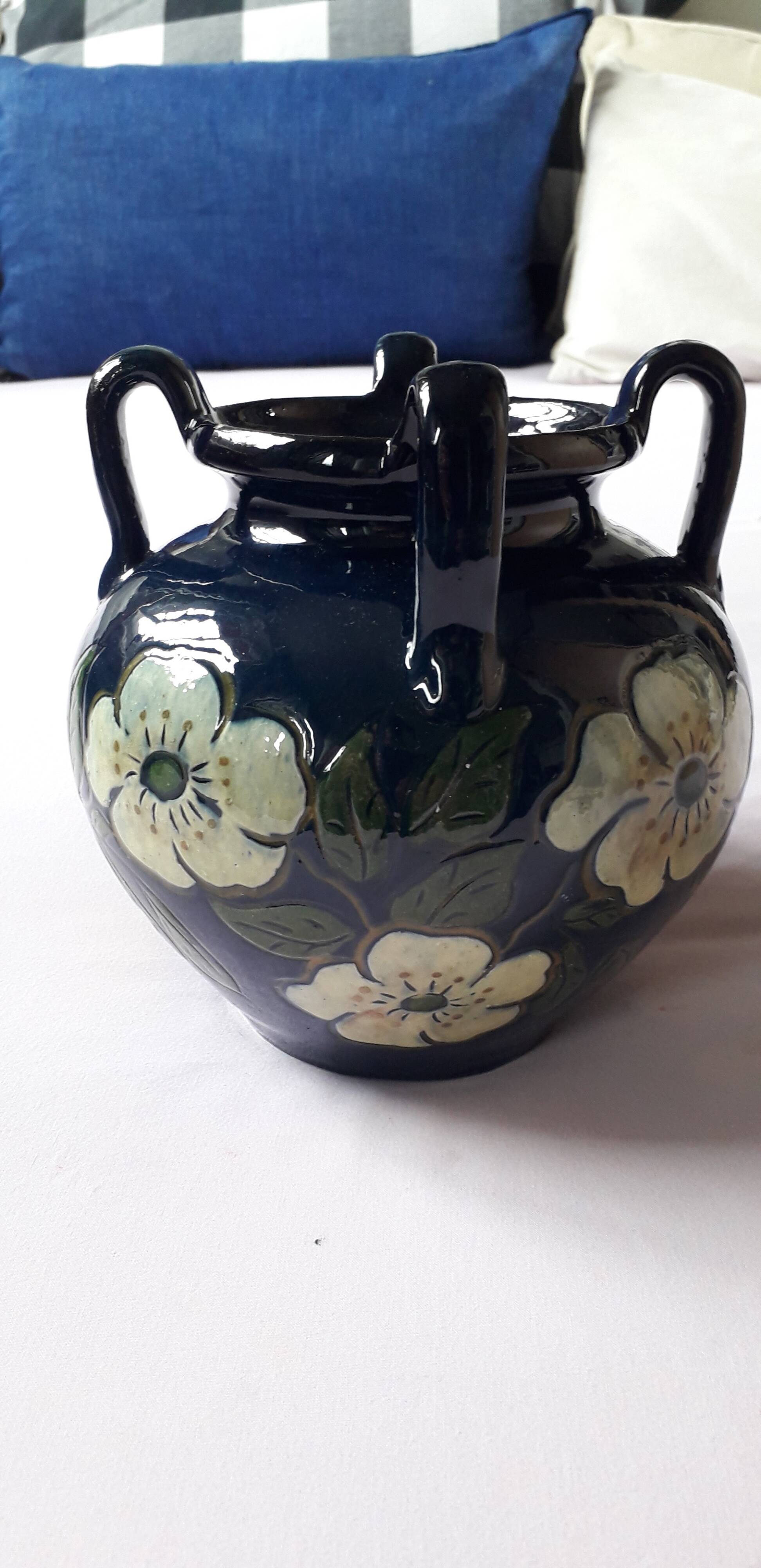Antique Art Nouveau vase with floral decoration.