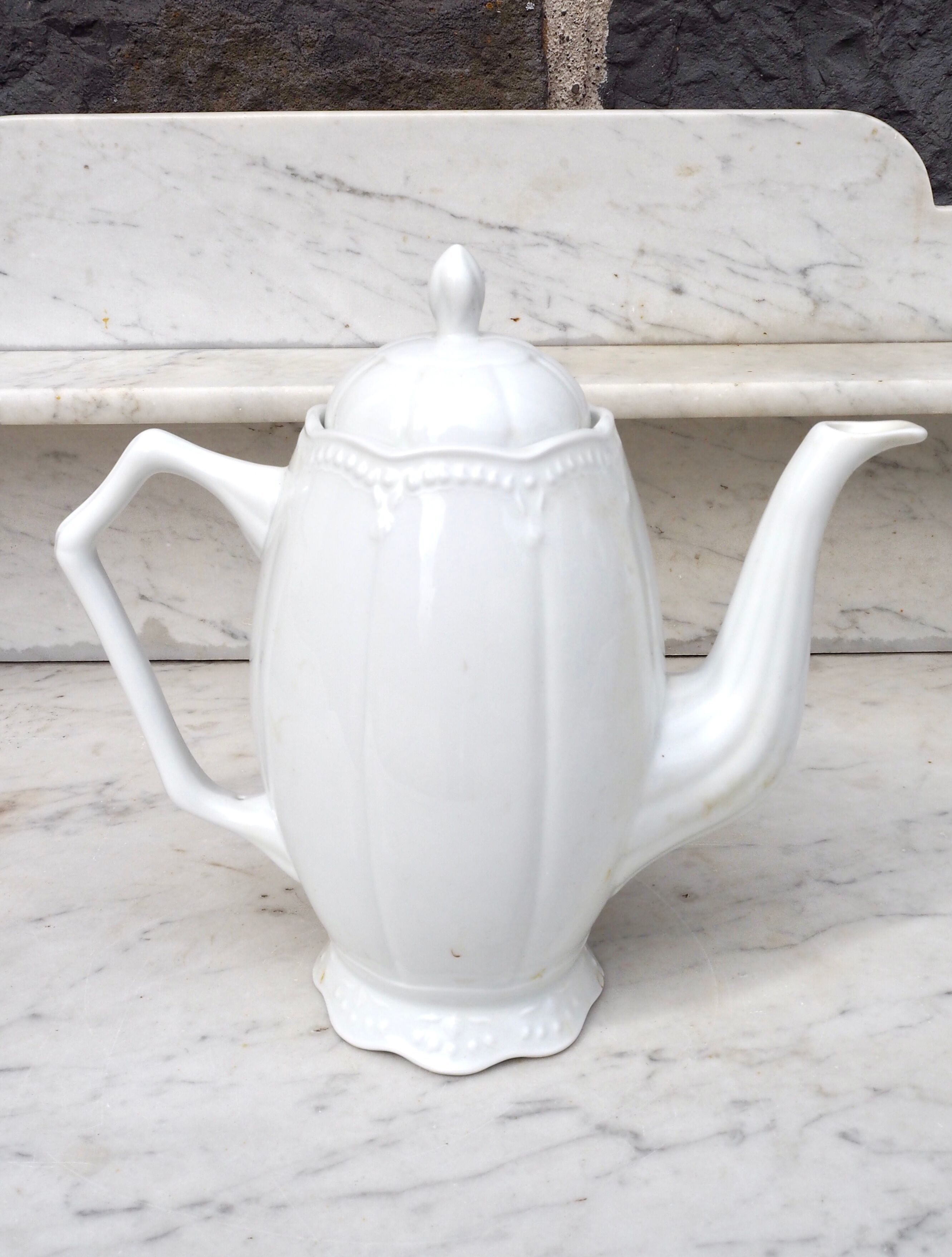 Worked white porcelain coffee maker
